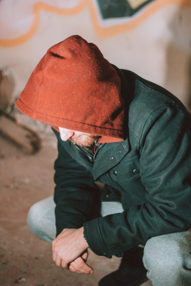 man with hoodie sitting