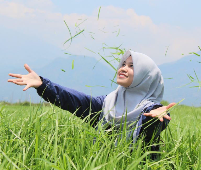 woman raising hands