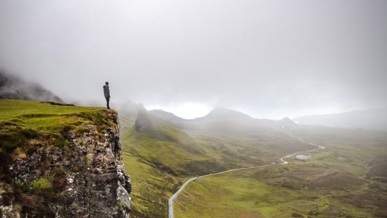 man at edge of cliff