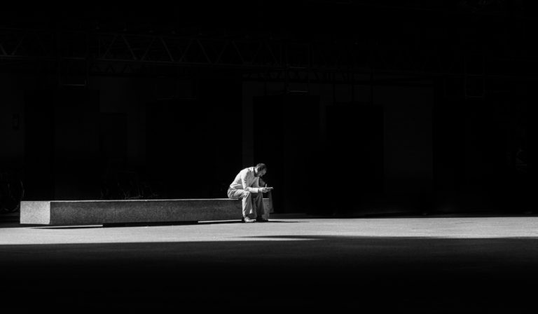 man on bench alone