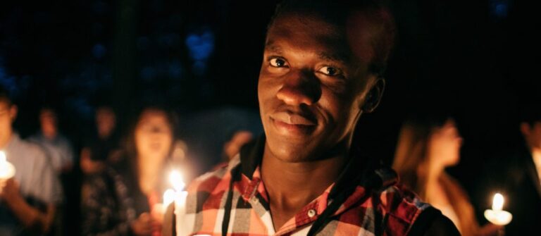 man holding candle